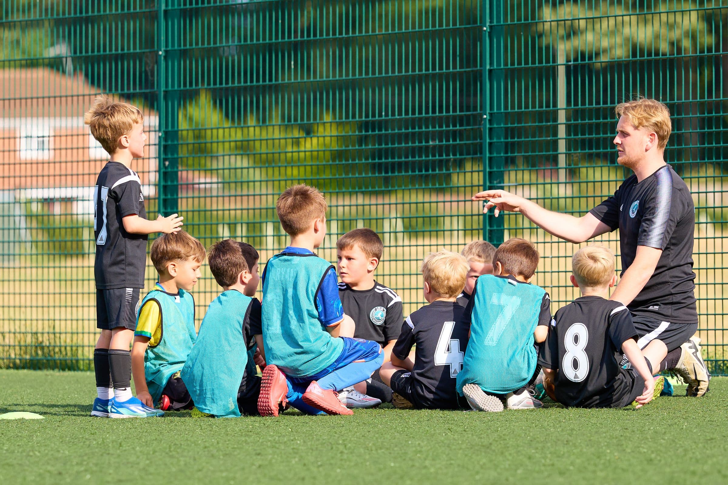 A JDA Academy squad gathered for a team talk