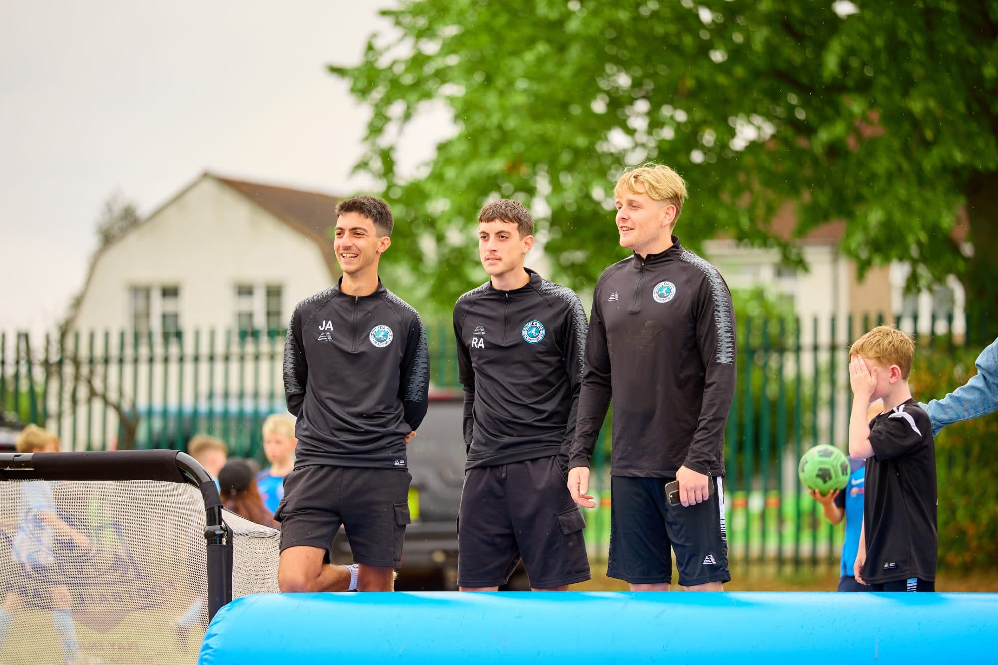 A JDA coach working with players during a session
