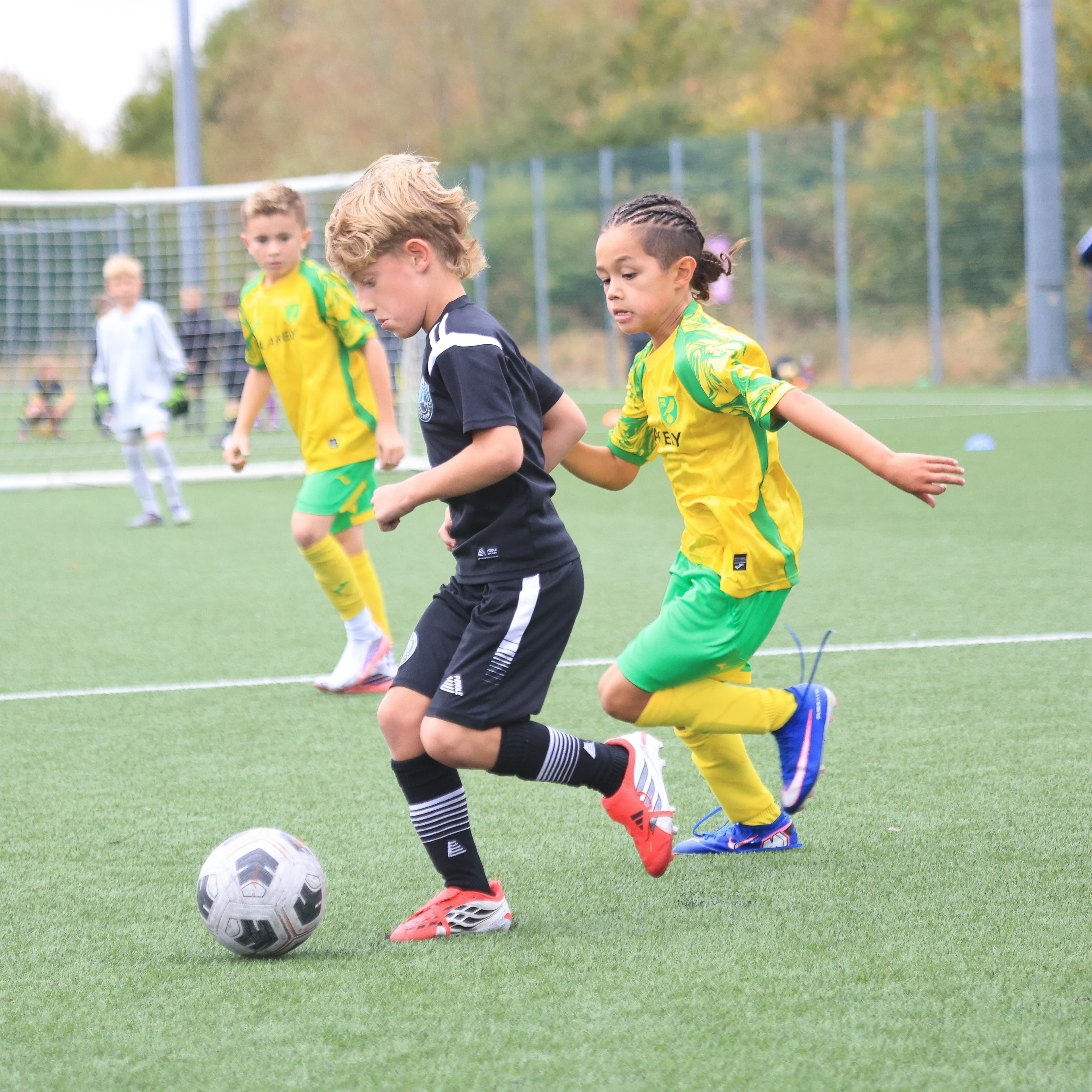 A JDA coach working closely with a player during a session