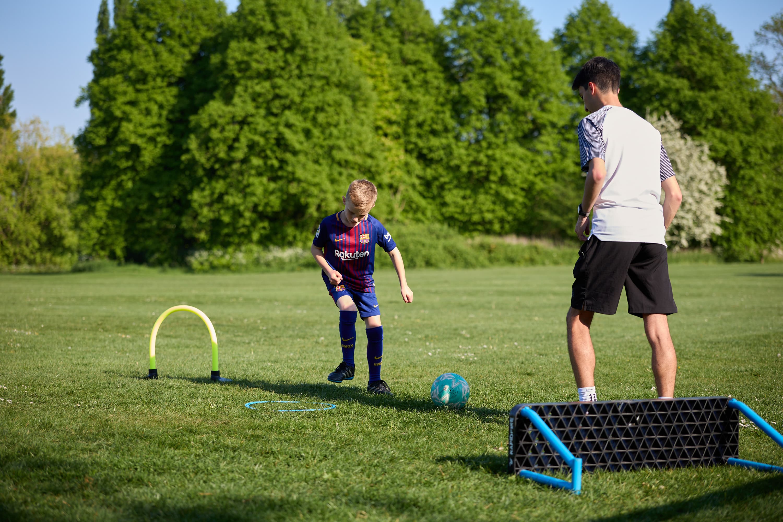 A JDA coach giving a player individual coaching attention